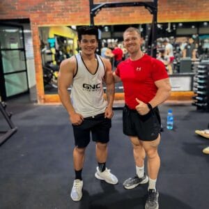 fitness coach with his client smiling after an energetic training session