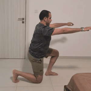 A man doing a squat in a bedroom, balancing fitness and relaxation in his personal space