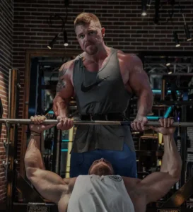 Christian Williams taking a client, into a very intense bench press session.