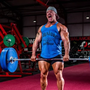 Christian Williams performing a heavy deadlift in the gym, demonstrating strength and power.