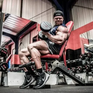 Close-up of an intense bicep pump during a dumbbell curl, highlighting muscle vascularity and the effects of L-Arginine on nitric oxide production