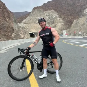 Coach Christian Williams shifting from bodybuilding to cycling, embracing endurance training while maintaining strength and performance